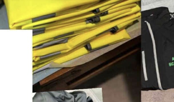A stack of yellow hi-vis garments ready for production